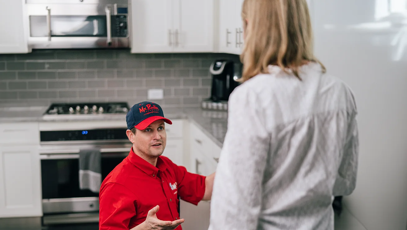 A Mr. Rooter plumbing professional at work.