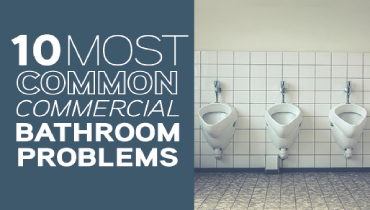 Three urinals on a white tile wall